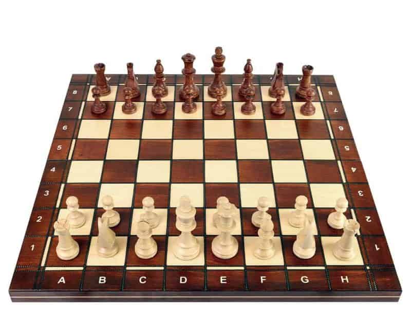 Wooden chess board with chess pieces